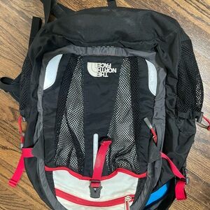 The North Face Black and Gray Backpack with Red Accents
